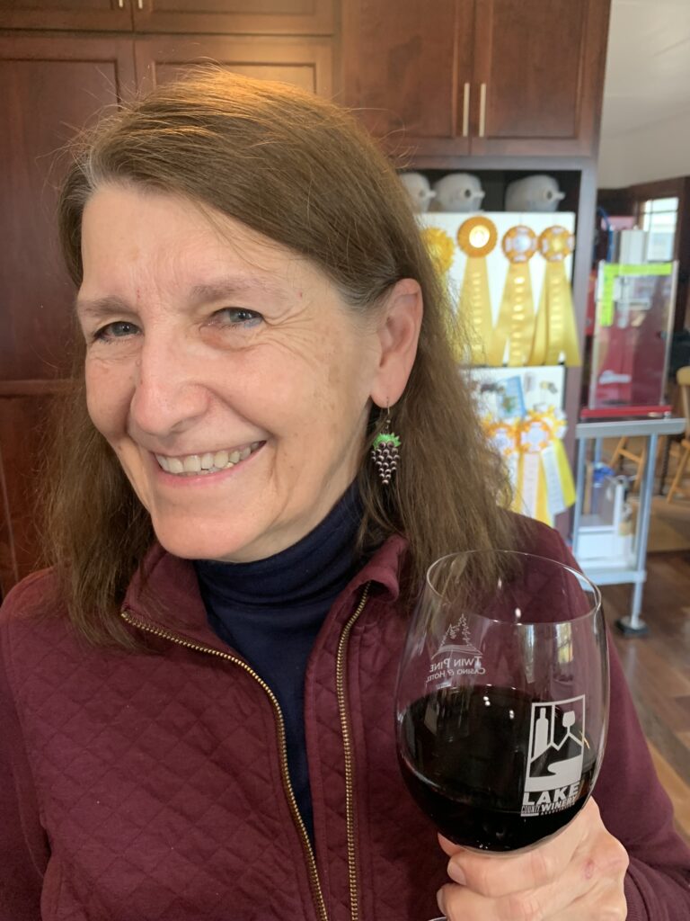 Velasquez in her home winemaking
room, enjoying a glass of her award-winning
Heron House wine